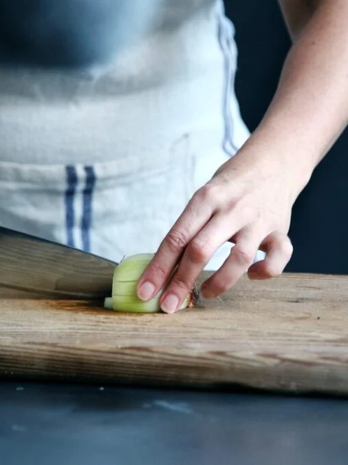 CHEF IN ACTION CHOPPING ONION